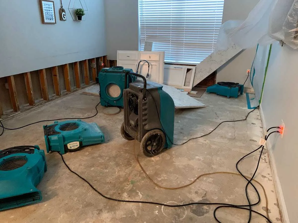 Dehumidifier in flood-cut room for Water Damage Restoration in Dardenne Prairie